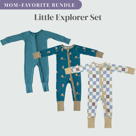 Three bamboo baby sleepers with different patterns on a light gray background