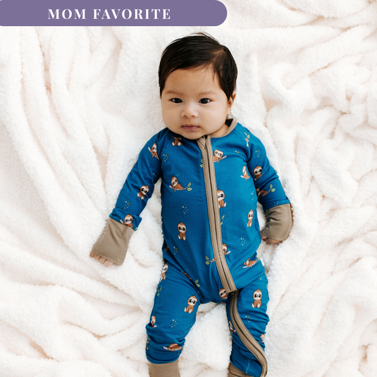 Baby in mom favorite Sleepy Sloth bamboo baby sleeper – a cozy, hypoallergenic sleeper made for sensitive skin. A must-have in bamboo baby clothes and a thoughtful baby shower gift.