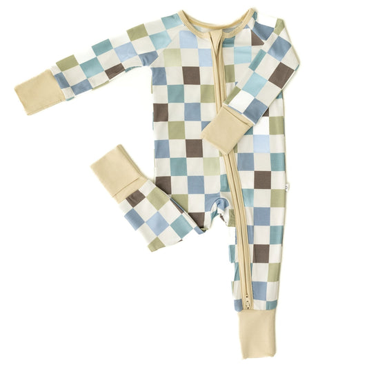 Flat lay of Luxe Checker bamboo baby sleeper – featuring a modern checkerboard print. These baby sleepers are a stylish and affordable choice in bamboo baby clothes and a perfect baby shower gift.