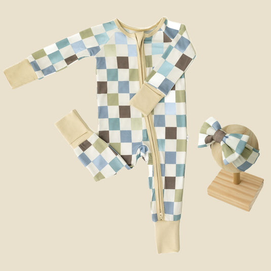 Luxe Checker | Baby Girl’s Essentials Bundle in Luxe Checker, featuring an ultra-soft bamboo sleeper and one of our matching baby bows. A stylish choice in bamboo baby clothes and for perfect baby shower gifts.