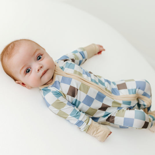 Baby in Luxe Checker bamboo baby sleeper – a trendy, ultra-soft sleeper designed for comfort. These baby sleepers are a favorite in bamboo baby clothes and a fashionable baby shower gift.
