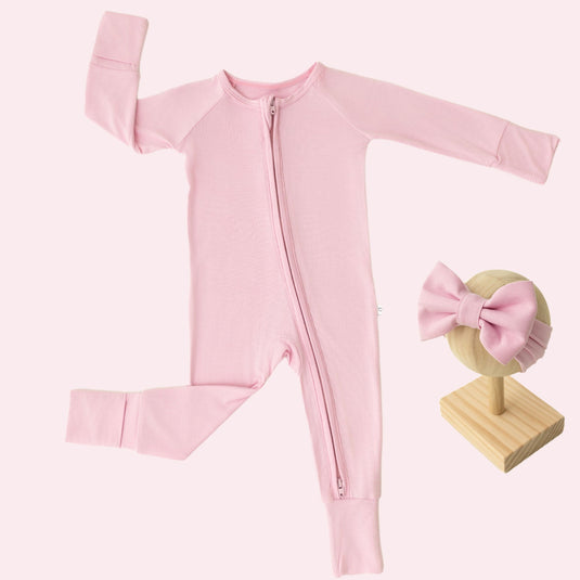 Baby Girl’s Essentials Bundle in Petal Glow, featuring an ultra-soft bamboo sleeper and one of our matching baby bows. A delicate and stylish pick in bamboo baby clothes and perfect for baby shower gifts.