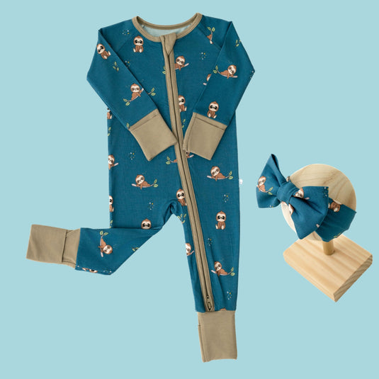 Baby Girl’s Essentials Bundle in Sleepy Sloth, featuring a luxuriously soft bamboo sleeper and one of our matching baby bows. A cozy and thoughtful baby shower gifts in bamboo baby clothes.