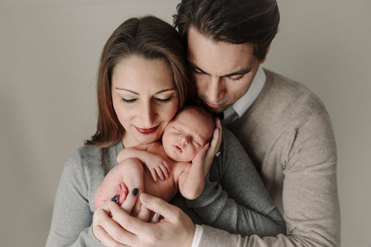 Brightcuties founders holding their newborn baby