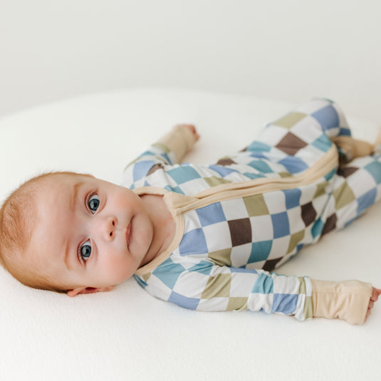 Baby in Luxe Checker bamboo baby pajamas, a trendy and ultra-soft baby onesies designed for comfort. A favorite in bamboo baby clothes and fashionable baby shower gifts.