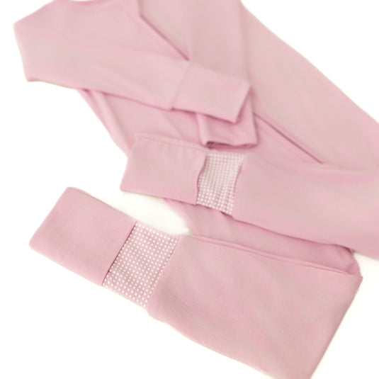 Close-up of Petal Glow bamboo baby pajamas, highlighting the luxurious stretch and gentle touch. These baby onesies are a must-have in bamboo baby clothes and for baby shower gifts.