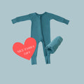 Thoughtful Giver Set in Blue Charcoal, features a silky-soft bamboo baby pajamas, matching swaddle blankets, and a baby onesies donated to a NICU family. A gender-neutral favorite in bamboo baby clothes and compassionate baby shower gifts.