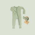 Baby Girl’s Essentials Bundle in Frosted Sage, featuring a breathable bamboo baby pajamas and one of our matching baby bows. A gender-neutral favorite in bamboo baby clothes and perfect for baby shower gifts.